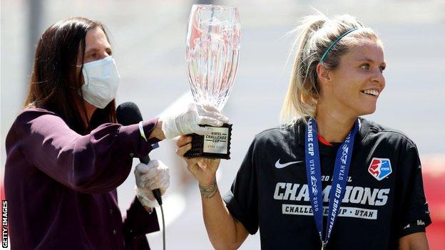 Rachel Daly is presented with the NSWL Challenge Cup trophy