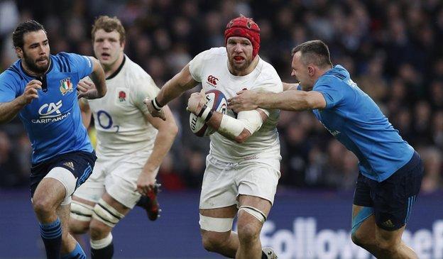 James Haskell is tackled by Italy's flanker Simone Favaro during the 2017 Six Nations match between England and Italy