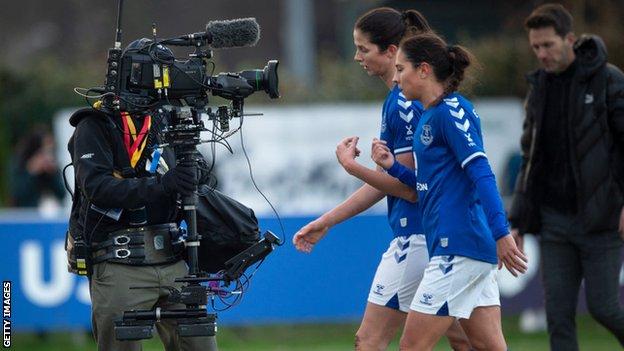 Camera following Everton players during a WSL game