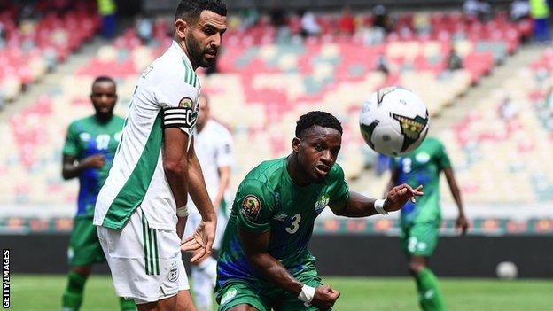 Kevin Wright (right) in action for Sierra Leone