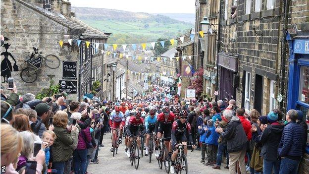 Team Ineos lead the peloton including leader Chris Lawless as they climb a hill in Haworth during stage four of the Tour de Yorkshire.