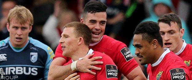 Munster's Andrew Conway celebrates his try with Jordan Coghlan, Shane Monahan and Francis Saili
