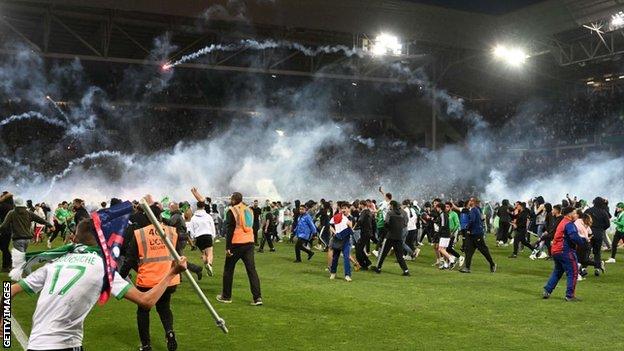 Saint-Etienne fans storm the field