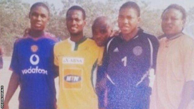 Ighalo (left) was picture wearing a Manchester United shirt during his childhood