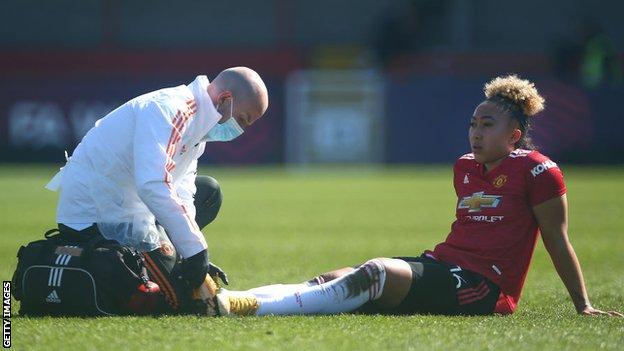 Lauren James receiving treatment for an injury while playing for Manchester United