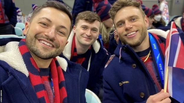 Fellow LGBTQ+ Winter Olympians Lewis Gibson and Bruce Mouat join Gus Kenworthy for a selfie at the 2022 Games in Beijing