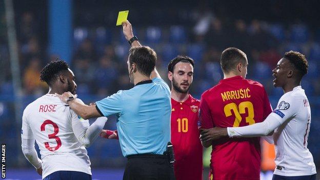 Danny Rose is booked during England's Euro 2020 qualifier in Montenegro