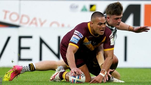 Tui Lolohea scores Huddersfield Giant's second try in their Super League victory over Hull FC