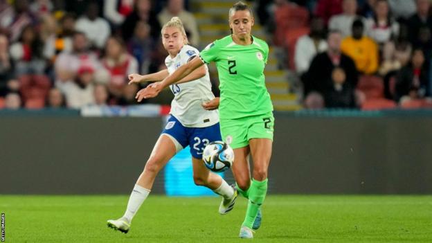 Ashleigh Plumptre battles for the ball with Alessia Russo