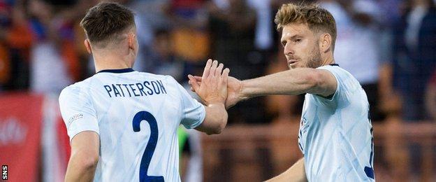 Scotland's Nathan Patterson and Stuart Armstrong celebrate