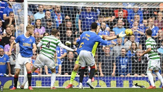 Rangers' Filip Helander beats Celtic's Joe Hart with a header