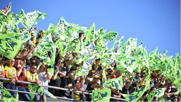 Valentino Rossi fans wave flags in Valencia