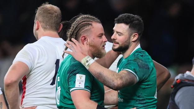 Finlay Bealham and Robbie Henshaw celebrate Ireland's win in 2022