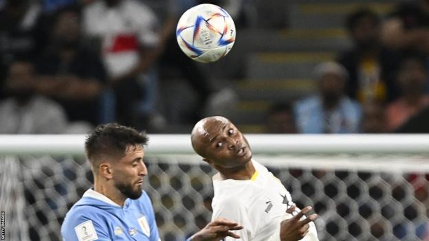 Ghana international Andre Ayew heads the ball at the World Cup