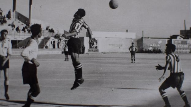 Mohamed Maouche heading a football