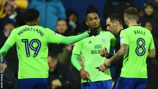 Cardiff City players remonstrate with referee Tim Robinson after he disallowed a Junior Hoilett goal
