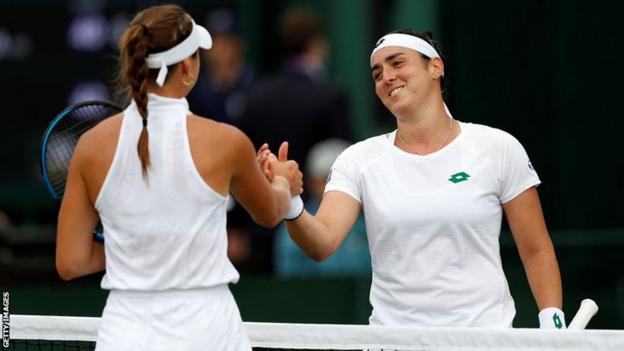 Tunisian tennis star Ons Jabeur (right)and Sweden's Rebecca Peterson shake hands after their first round match at Wimbledon 2021