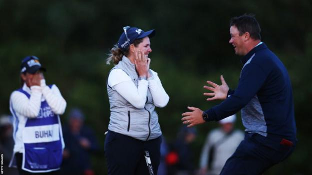 South Africa's Ashleigh Buhai looks shocked as her husband David joins her to celebrate winning the 2022 Women's Open at Muirfield