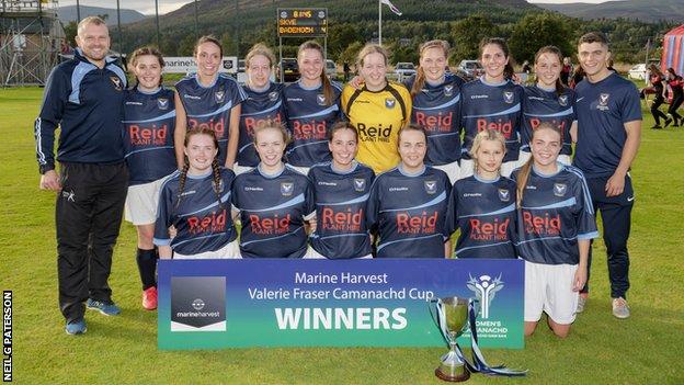 Badenoch and Strathspey celebrate with the Valerie Fraser Camanachd Cup