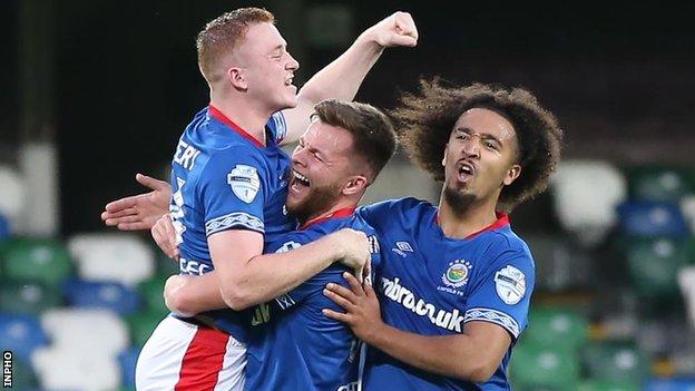 Shayne Lavery (left) celebrates one of his goals with Niall Quinn and Bastien Hery