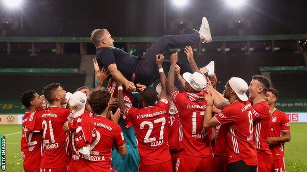 Hansi Flick in celebration with his old Bayern Munich players