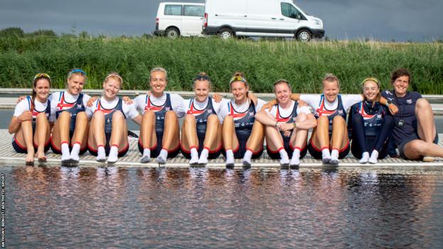 Oonagh Cousins and her team-mates sat on a jetty