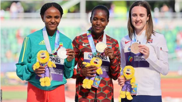 Laura Muir with medal, right