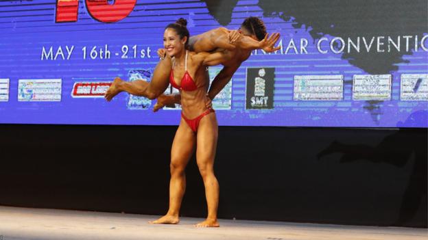Yangon, Myanmar, 19 May: Kritkhun Phukorawat and Chadathip Chantarat from Thailand compete in Mixed Pairs Open Category during the 16th Southeast Asia Bodybuilding and Physique Sports Championships. (Photo by EPA-EFE/NYEIN CHAN NAING)