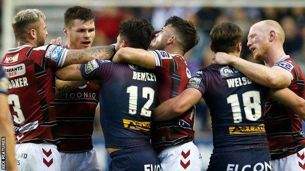 Wigan Warriors and St Helens players confront each other during Friday's game