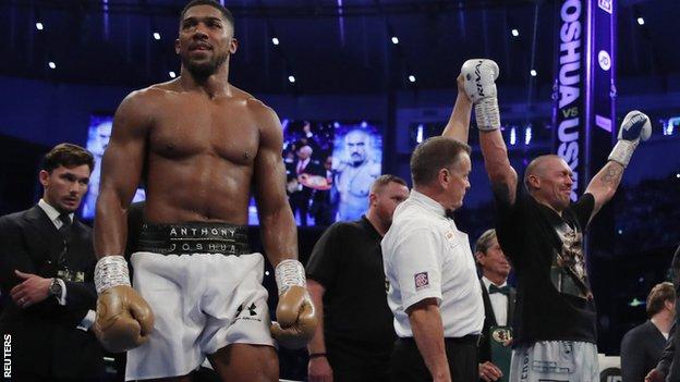 Anthony Joshua reacts as Oleksandr Usyk is announced the winner