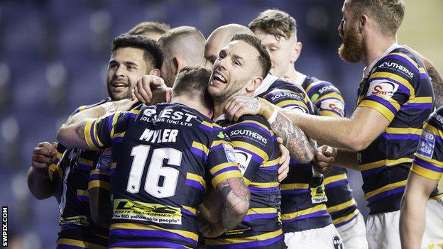 Leeds Rhinos players celebrate a try