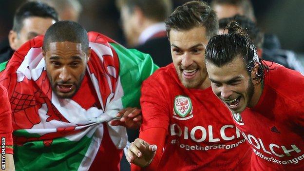 Ashley Williams, Aaron Ramsey and Gareth Bale celebrate Wales' Euro 2016 qualification
