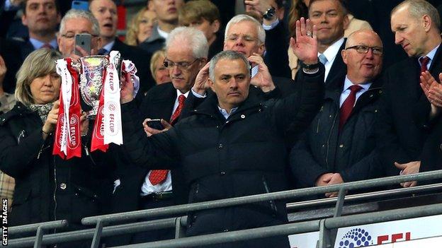 Jose Mourinho lifts the EFL Cup
