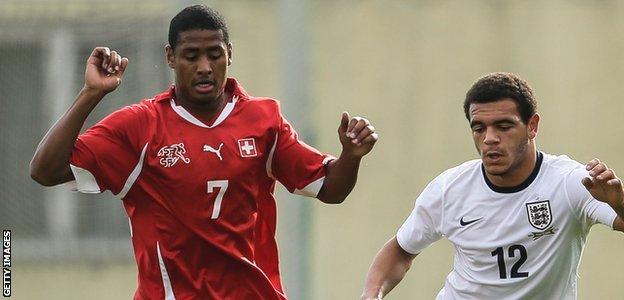 Saidy Janko (left) in action for Switzerland Under-19s against England