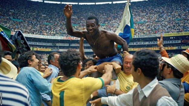 Pele is held aloft by fans after Brazil won the 1970 World Cup