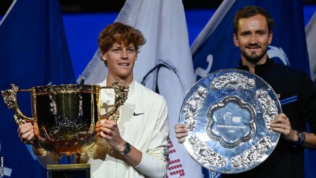 Jannik Sinner and Daniil Medvedev pose with their trophies after the China Open final