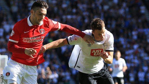 Charlton Athletic's Tony Watt (left) tussles for possession with Derby County's Craig Forsyth