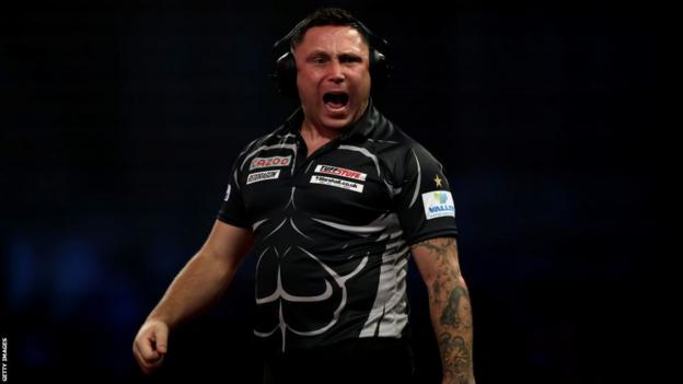 Gerwyn Price wearing ear defenders