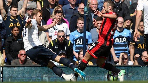 Jack Wilshere collides with Tottenham's Harry Kane