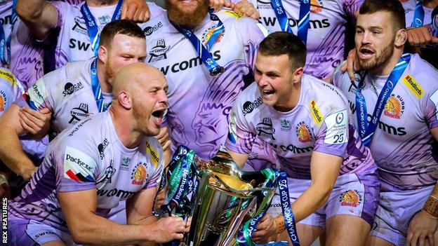 Joe Simmonds lifts the Champions Cup with Exeter