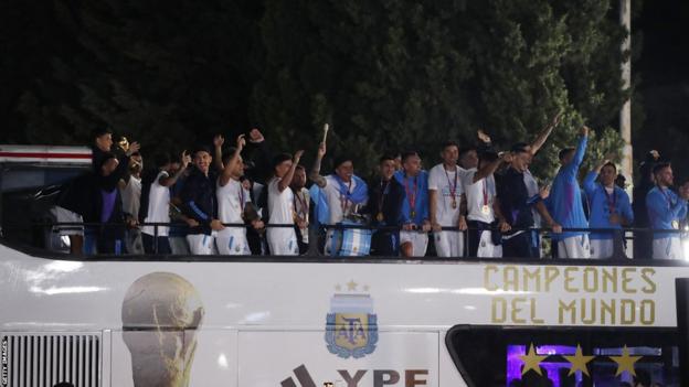 Argentina players on an open-top bus