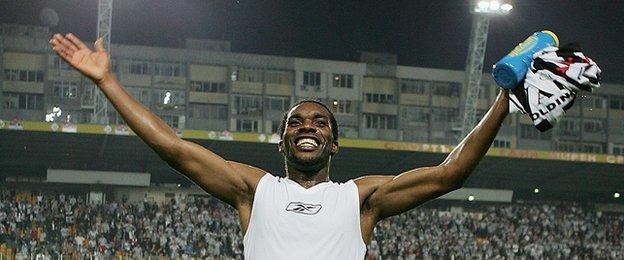 Jay-Jay Okocha of Bolton celebrates at the final whistle during the UEFA Cup 1st round second leg match between and Lokomotiv Plovdiv and Bolton Wanderers at the Naftex Stadium on September 29, 2005 in Bourgas, Bulgaria