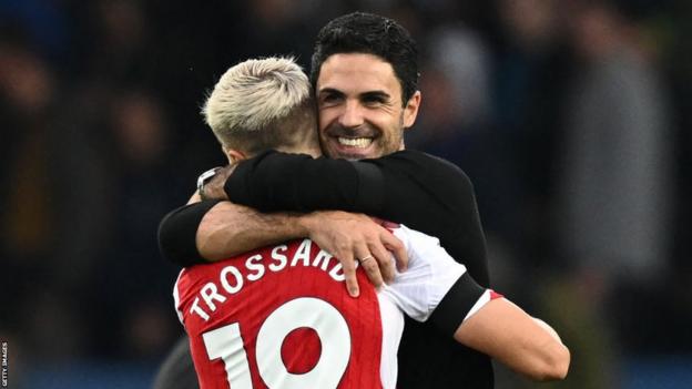 Arsenal manager Mikel Arteta celebrates his side's football win at Everton with Leandro Trossard