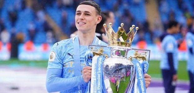 Phil Foden with the Premier League trophy