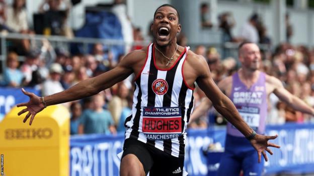 Zharnel Hughes celebrates after winning the men's 200m at the British Championships