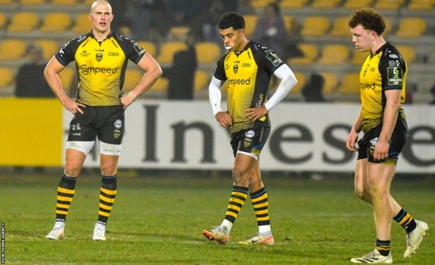 Dragons players looking down