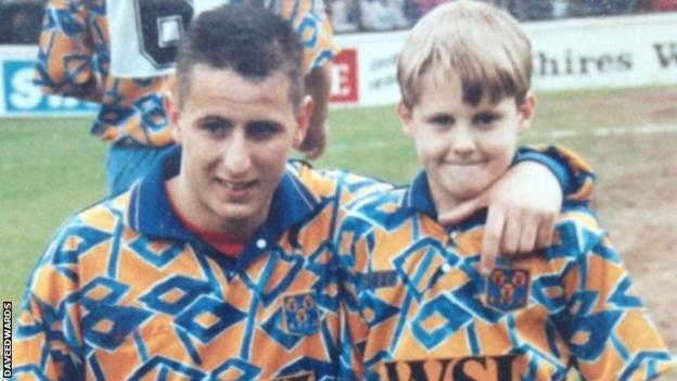 Dave Edwards (right) as a Shrewsbury Town mascot with former Shrews and Manchester City forward Carl Griffiths