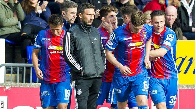 Aberdeen manager Derek McInnes in amongst the celebrating Caley players