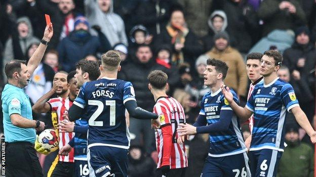 Middlesbrough's Dael Fry (right) was sent off for bringing down Ross Stewart early in the second half