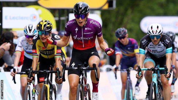 Dutch rider Demi Vollering (centre) celebrates winning the 2021 La Course